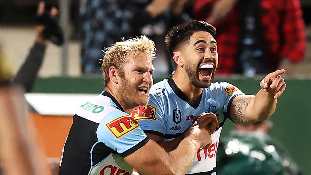 Shaun Johnson of the Sharks celebrates with his teammates after scoring a try during the round 14 NRL match between the Cronulla Sharks and the Penrith Panthers at Netstrata Jubilee Stadium, on June 11, 2021, in Sydney, Australia. (Photo by Mark Kolbe/Getty Images)