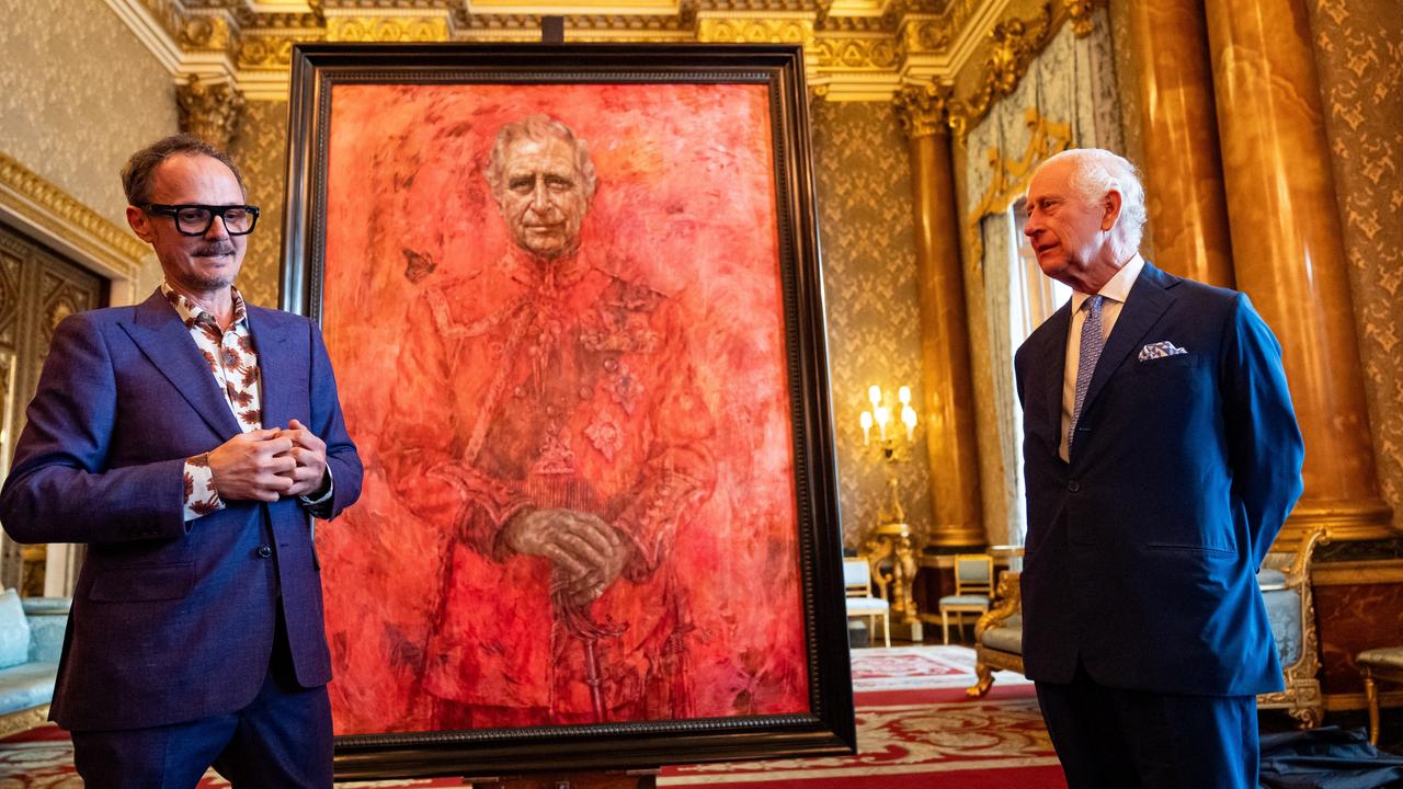 Artist Jonathan Yeo and King Charles III stand in front of the portrait when it was unveiled at Buckingham Palace in May. Picture: Getty Images