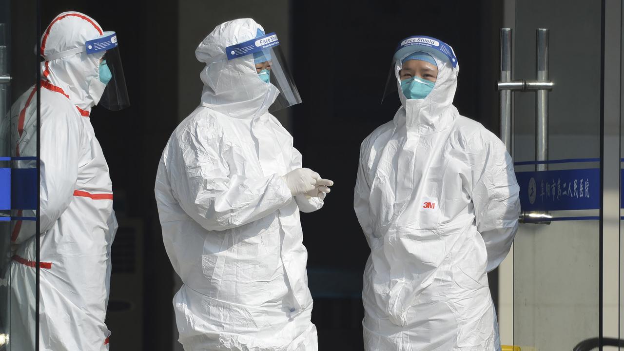 Medical staff in protective outfits treat fever patients from Wuhan in Fuyang in central China's Anhui Province. Picture: Chinatopix via AP)