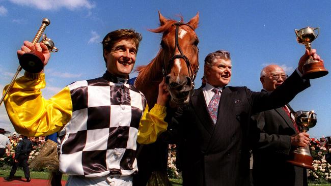 Darren Beadman and trainer Bart Cummings with Saintly at the 1996 Melbourne Cup race presentation.