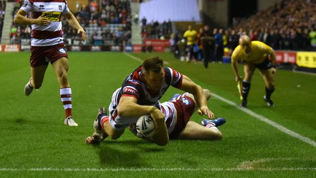 Brett Morris bagged a hat-trick in the first half of his Sydney Roosters debut to stun Wigan. Picture: Getty