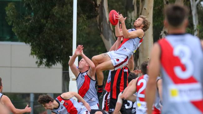 Action from Tea Tree Gully's upset win over Rostrevor Old Collegians on Saturday. Picture: Brayden Goldspink