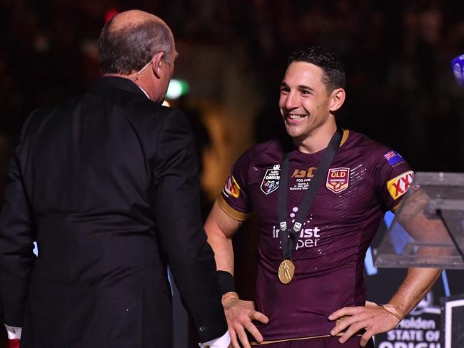 Billy Slater (right) of the Maroons is presented with the player of the series medal by Wally Lewis (left) after Game 3 of the 2018 State of Origin series. Picture: AAP Image/Darren England