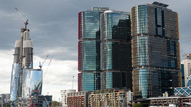 Crown’s Sydney casino, left, under construction at Barangaroo.