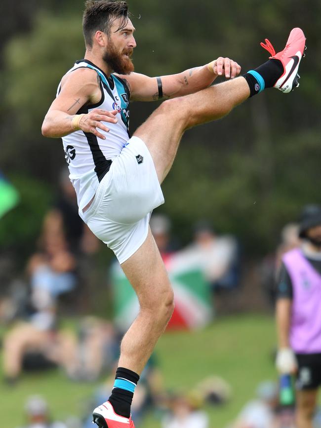 Charlie Dixon boots one of his four goals against the Lions. Picture: DARREN ENGLAND (AAP).