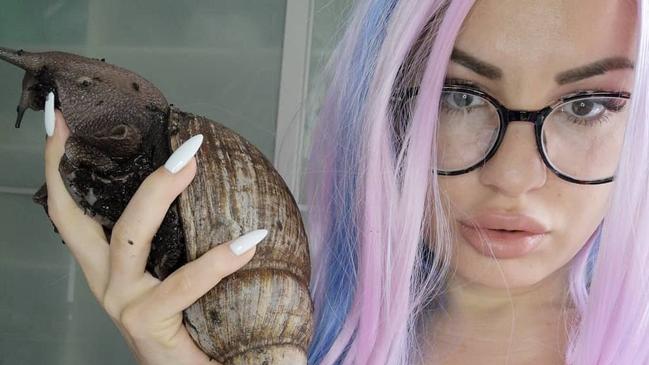 Kris Buckley with a snail. See SWNS story SWSMsnail. Meet the single mum who became a snail influencer and went from living off benefits to making six figures every year selling and breeding snails. Before breeding snails, Kris Buckley, from Munich, Germany was caring for her son who was hospitalised with a hole in his stomach, gastroschisis. Because she was caring for her son, whose details she would not reveal, she was unable to work and had to live off the state. Kris, who would not state her age, felt like she needed a hobby of her own, as all of her time was spent meeting his needs, so she decided to get a pet in 2017.