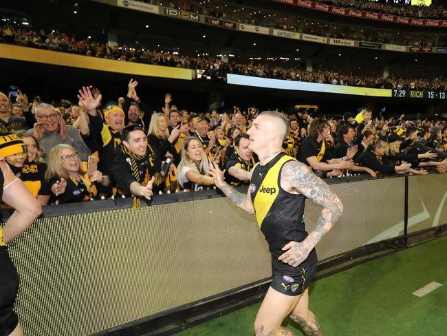 Dustin Martin celebrate Richmond’s win with fans. Picture: Alex Coppel