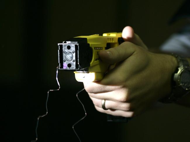 NA: QWeekend - Taser. Acting Sergeant Peter Bateman fires a Taser at Queensland Police Academy.