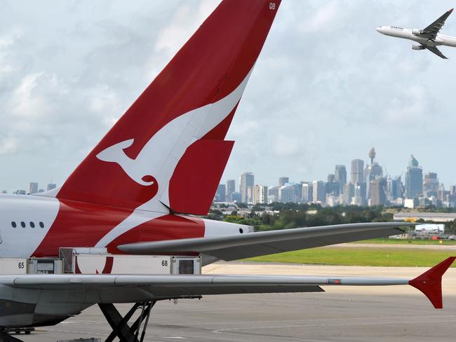 "Sydney, Australia - March, 14th 2012: Quantas aeroplanes and tail fin with the distant view of downtown Sydney - Sydney Airport". Picture: iStock