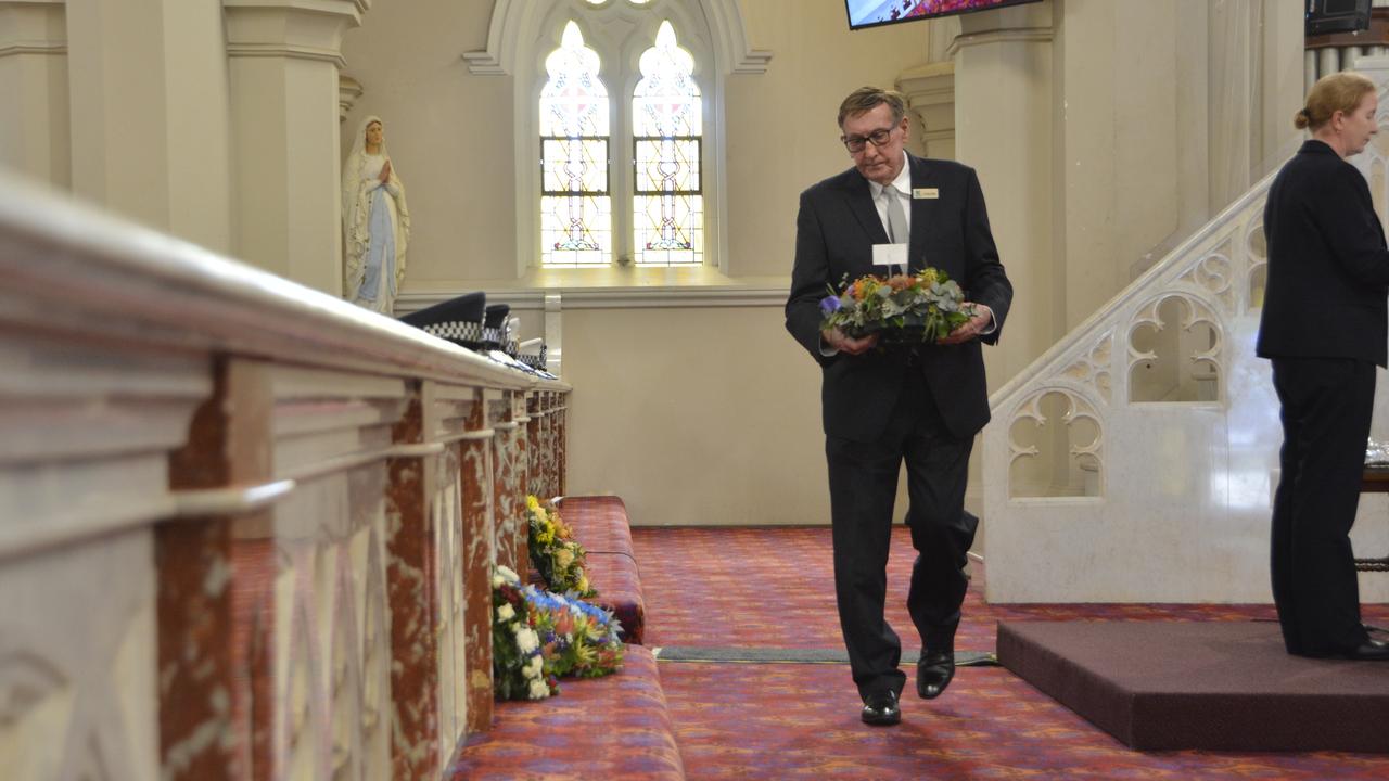 Toowoomba Councillor Kerry Shine lays a floral tribute at the National Police Remembrance Day service in St Patrick's Cathedral, Toowoomba, September 27, 2024.