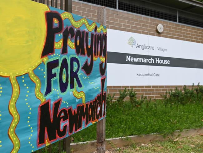 Signs and flowers continue to be left at the entrance to Anglicare’s Newmarch House at Kingswood, NSW. Picture: AAP
