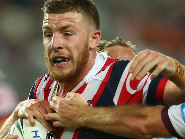 SYDNEY, AUSTRALIA - MARCH 26: Jackson Hastings of the Roosters is tackled during the round four NRL match between the Sydney Roosters and the Manly Sea Eagles at Allianz Stadium on March 26, 2016 in Sydney, Australia. (Photo by Mark Kolbe/Getty Images)