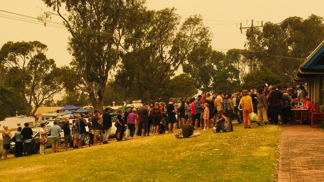 The Naval evacuation sign-up queue at Mallacoota. Picture: Peter Waterhouse