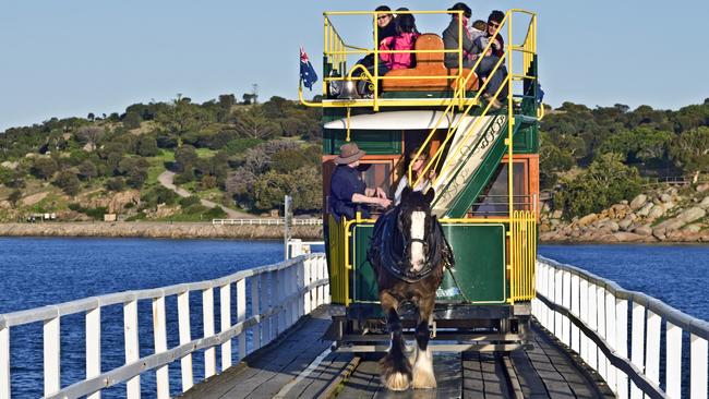 The horse-drawn tram crosses the causeway from Granite Island. Picture: Marina Saint Martin