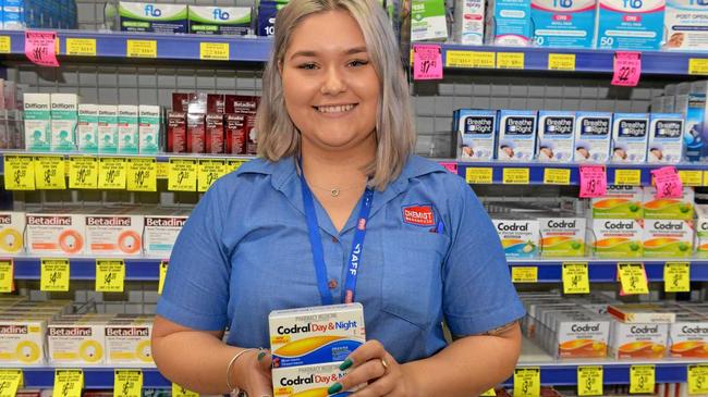 TAKE CARE: Chemist Warehouse staff member Georgia Wheat recommends products when you're feeling ill. Picture: Rhylea Millar