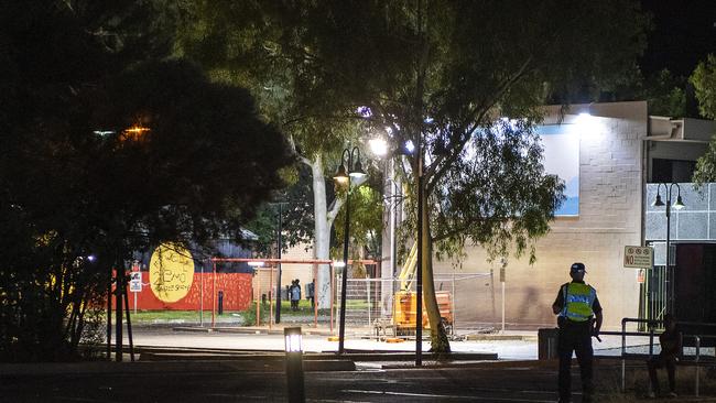 A police officer spots young local children on the streets of Alice Springs at night before giving chase. Picture: Mark Brake