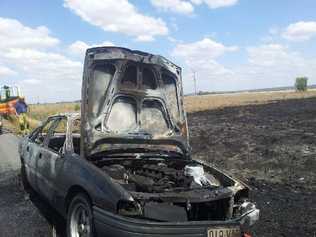 The burnt out remains of a Holden about 40kms from Dalby that caught fire about 12.15pm. . Picture: Elouise Quinlivan