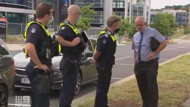 The Revival Church pastor Paul Furlong speaks to police after a service in Narre Warren that breached lockdown restrictions on Sunday. Picture: Twitter/@9NewsMelb