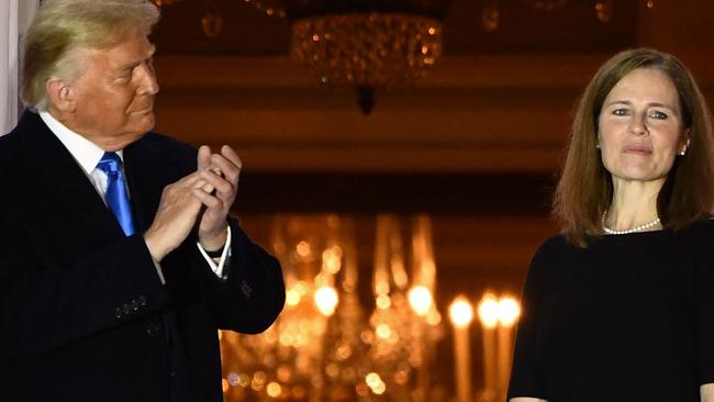 Mr Trump and Ms Barrett in October of 2020, shortly before the presidential election, when she was appointed to the Supreme Court. Picture: Brendan Smialowski/AFP