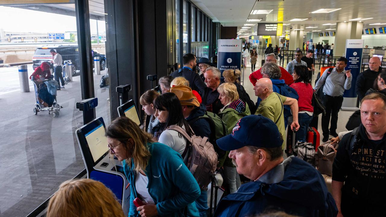 People wait in line for a delayed flight at Newark International Airport on Monday. Picture: Spencer Platt/Getty Images/AFP