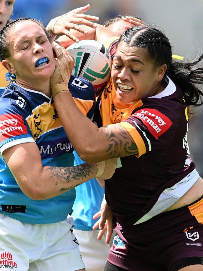 Roxette Murdoch of the Broncos attempts to break free of a tackle.