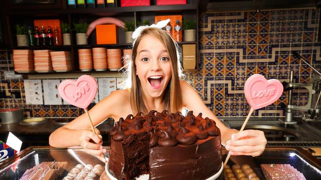 Nicola Crisafulli, at San Churro Chocolateria Surfers Paradise, with a Death by Chocolate Cake. Picture: Nigel Hallett