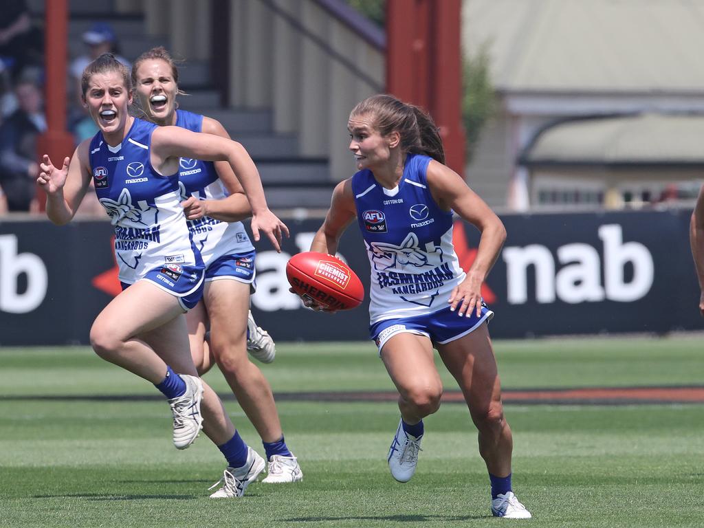 North Melbourne’s Ashleigh Riddell running with the ball. Picture: LUKE BOWDEN