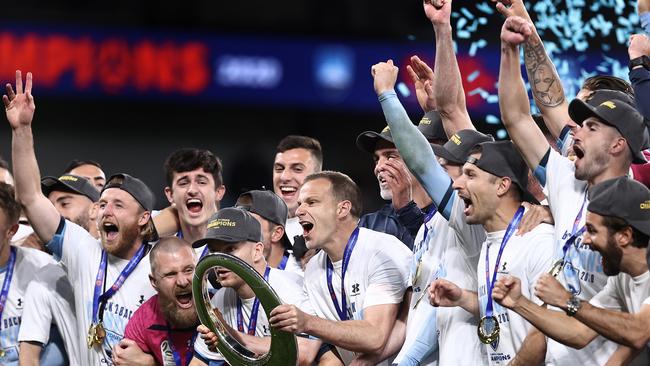 Alex Wilkinson lifts the A League Trophy after Sydney FC’s win.