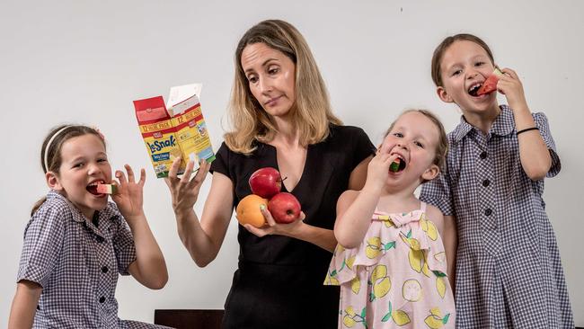 Cathie Beven tries to make healthy food choices for her daughters, Audrey, 4, Chloe, 7 and Ruby, 8. Picture: Jake Nowakowski