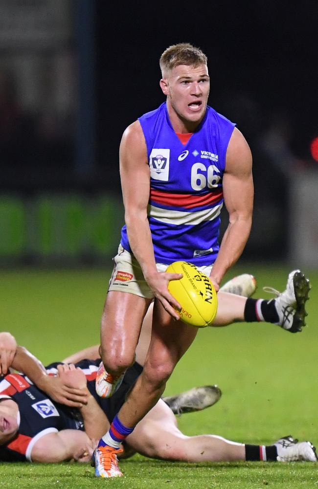 Robbie McComb bursts out of a stoppage. Pic: Morgan Hancock/AFL Photos