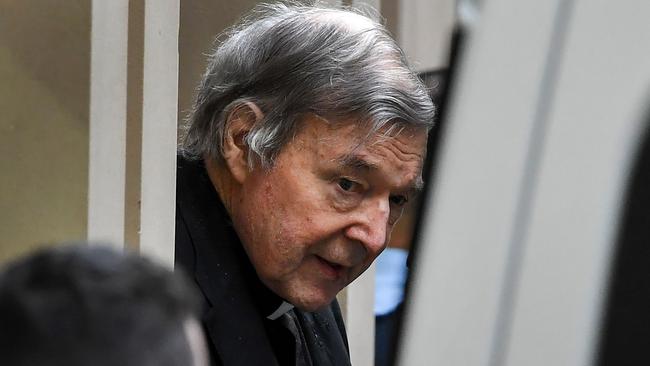 George Pell in handcuffs leaves the Supreme Court of Victoria in Melbourne.after his conviction. Picture: AFP.