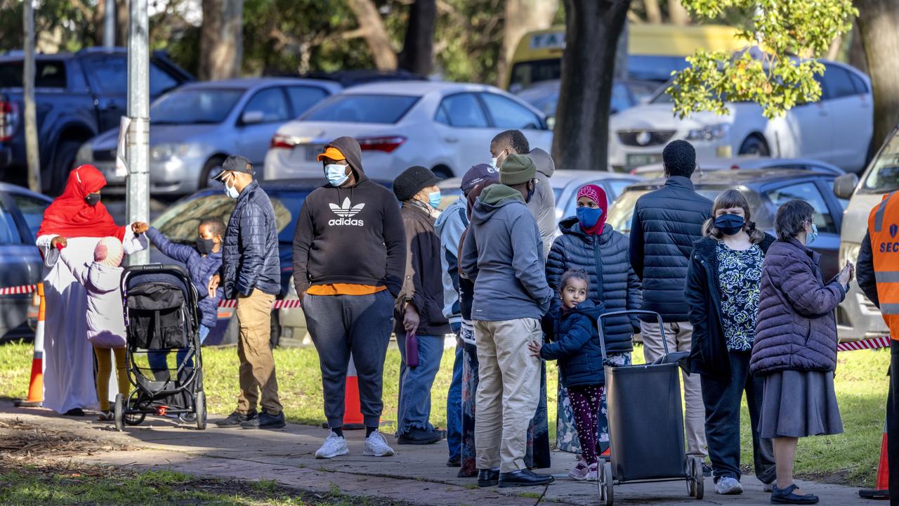 Residents queue for testing outside 130 Racecourse Rd, Flemington. Picture: NCA NewsWire / David Geraghty