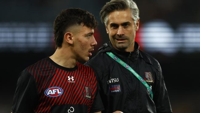 Massimo D’Ambrosio chats with assistant coach Daniel Giansiricusa before his debut.