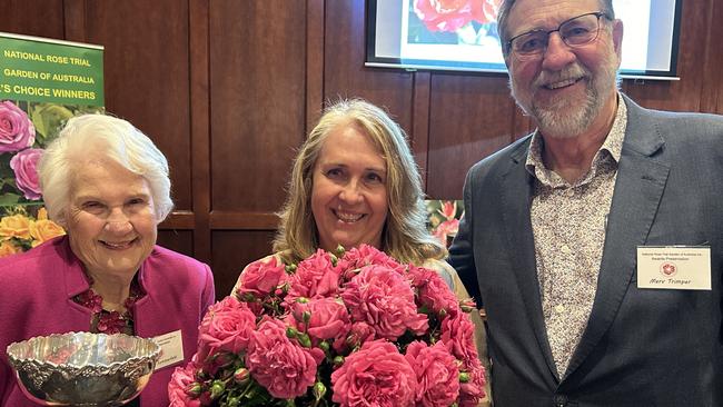 Laurel and Kylie Sommerfeld with Merv Trimper (National Rose Trial Garden of Australia) and her entry, the Great Balls of Fire roses.