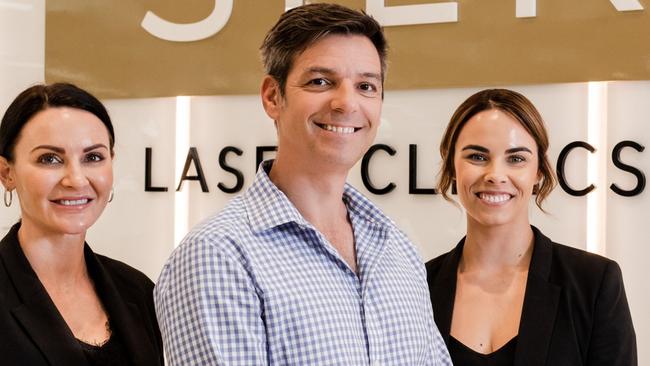 SILK Laser Clinics chief executive Martin Perelman with staff Lauren Blowers, left, and Emily Matthews, right. Supplied