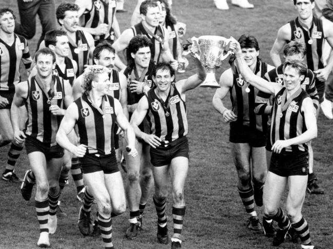 Russell Morris (right) holds up the premiership cup in 1986.