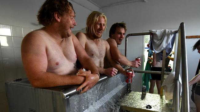 Berri Demons A Grade footballers Geordie Franks, Marty Barker and Jamie Milburn hit the ice bath after the game. Picture: BERNARD HUMPHREYS