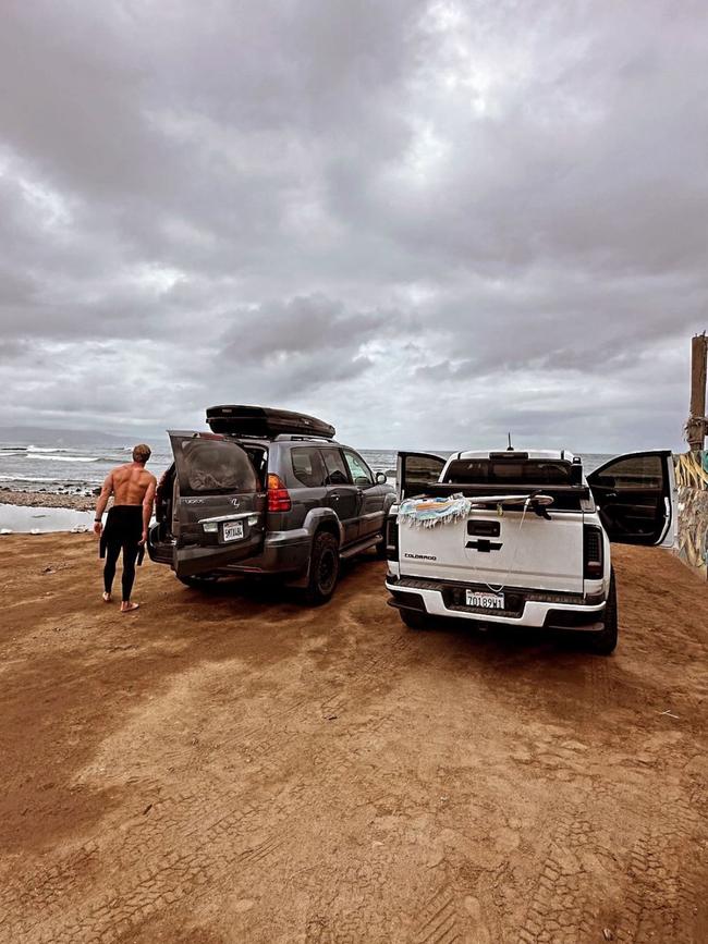 The brothers pictured getting ready to surf.