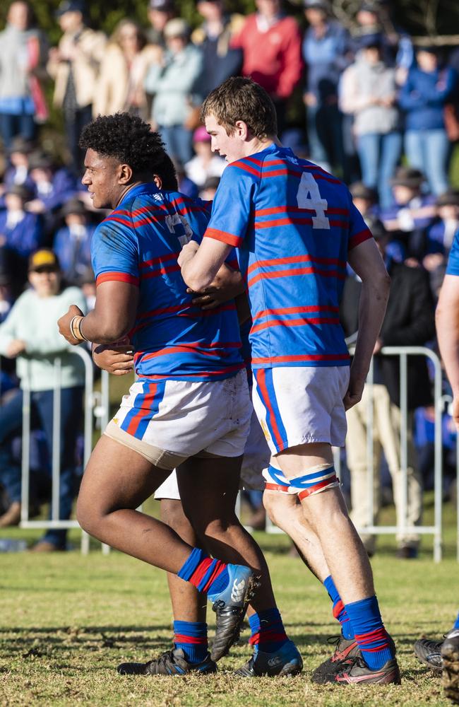 Downlands celebrate a try by Trevor King (left) against Grammar in O'Callaghan Cup on Grammar Downlands Day at Downlands College, Saturday, August 6, 2022. Picture: Kevin Farmer