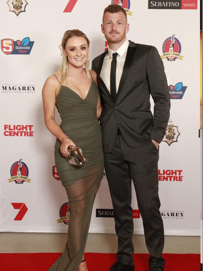 Courtney Matheson wearing Nooki, and Matt Appleton pose for a picture on the red carpet at Adelaide Oval in North Adelaide, for the Magarey Medal, Monday, September 9, 2019. Picture: Matt Loxton