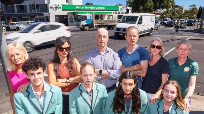 Parents Niki Munoz, Victoria Bardsen, John Symons, Christopher Scanlon, Denise Linnane and Sally OShannessy with students Elias Munoz, Maja Symons, Estelle Centurion and Violet Scanlon from Port Melbourne Secondary College at the intersection of Williamstown Road and Graham Street in Port Melbourne where there have been several close misses involving trucks and cars. Picture: Brendan Beckett. Picture: Brendan Beckett