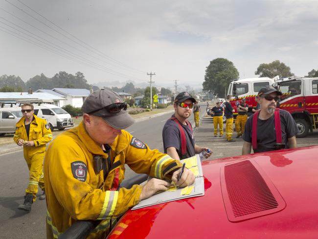 Fire fighters prepare for the threat at Geeveston. Picture: CHRIS KIDD