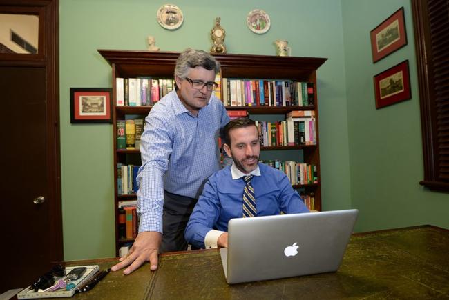 Barristers Ross Lo Monaco and Jordan Ahlstrand search for photos taken in the old Rockhampton Supreme Court building showing "Orbs" which denote the presence of spirits. Photo: Chris Ison / The Morning Bulletin. Picture: Chris Ison