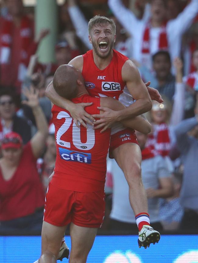 Kieren Jack leaps into Sam Reid’s arms after kicking a goal. Picture: Getty Images