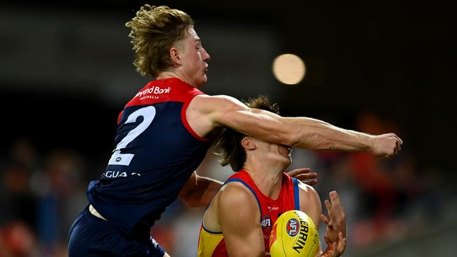 GOLD COAST, AUSTRALIA - MAY 06: Charlie Ballard of the Suns suffers an injury while challenging for the ball against Jacob van Rooyen of the Demons  during the round eight AFL match between the Gold Coast Suns and the Melbourne Demons at Heritage Bank Stadium, on May 06, 2023, in Gold Coast, Australia. (Photo by Albert Perez/AFL Photos via Getty Images)