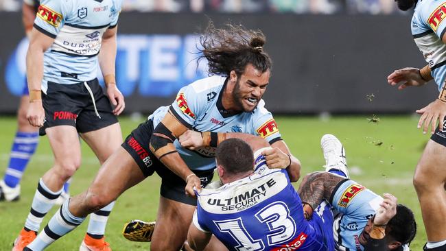 Toby Rudolf of the Sharks tackles Adam Elliott of the Bulldogs during the Round 6 NRL match between the Cronulla-Sutherland Sharks and the Canterbury-Bankstown Bulldogs at Bankwest Stadium in Sydney, Sunday, June 21, 2020. (AAP Image/David Neilson) NO ARCHIVING, EDITORIAL USE ONLY