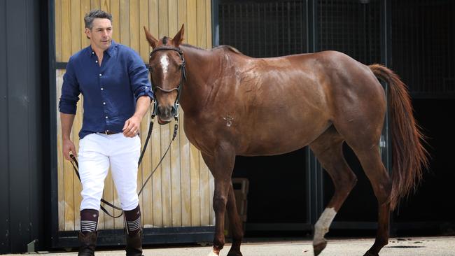 Billy Slater with a polo pony near the stables. Picture: David Caird