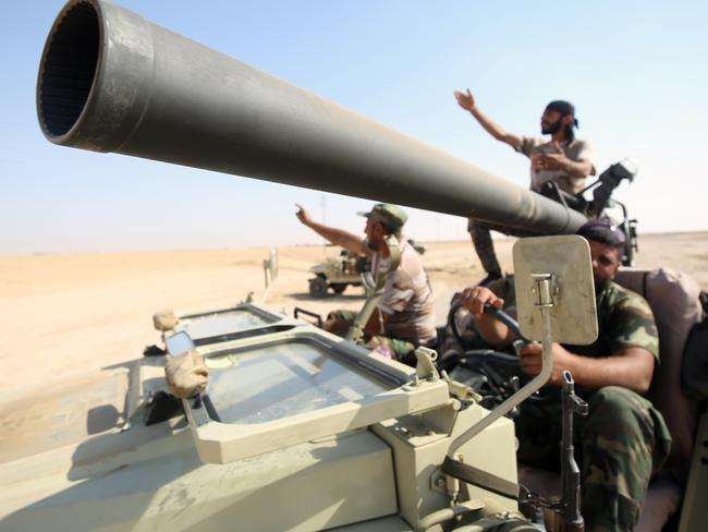 Shiite fighters from the Popular Mobilization Forces arrive in an area south of Mosul during an operation to retake the main hub city from Islamic State. Picture: AFP PHOTO/AHMAD AL-RUBAYE