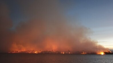 A bushfire at Dolphin Sands is threatening the small coastal town. Picture: TASH HARRIS