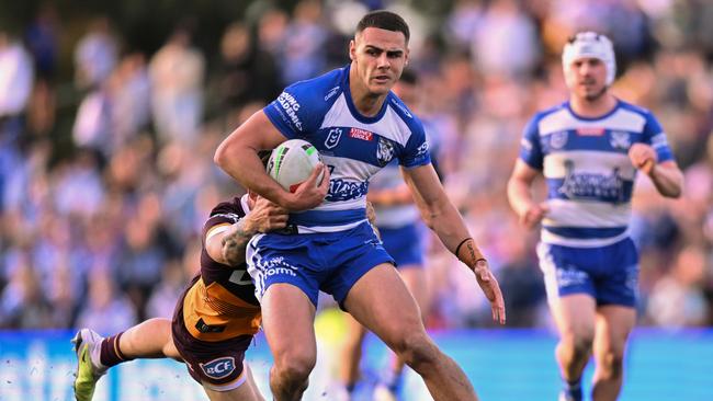 SYDNEY, AUSTRALIA - JULY 15: Jacob Kiraz of the Bulldogs is tackled during the round 20 NRL match between Canterbury Bulldogs and  Brisbane Broncos at Belmore Sports Ground on July 15, 2023 in Sydney, Australia. (Photo by Izhar Khan/Getty Images)